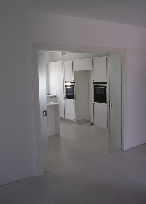 Porta doppia scorrevole tuttovetro